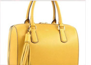 الحقيبة ذات المقبض لإطلالة أنيقة هذا الموسم