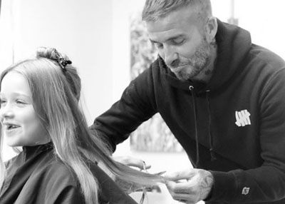 ديفيد بيكهام يرضخ أخيراً لرغبة ابنته ويساعد في قص شعرها الطويل